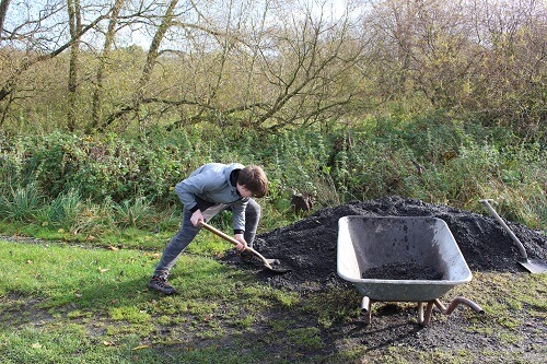 Theo filling the barrow.